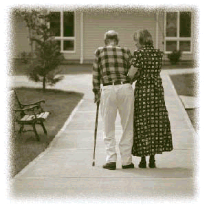 Photograph of a man and a woman walking